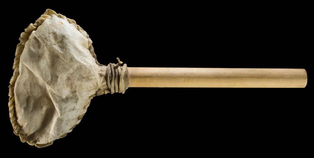 Rattle, (Anishinaabek).Rawhide, wood. On loan from Rama First Nation Historical Archives. L022.17